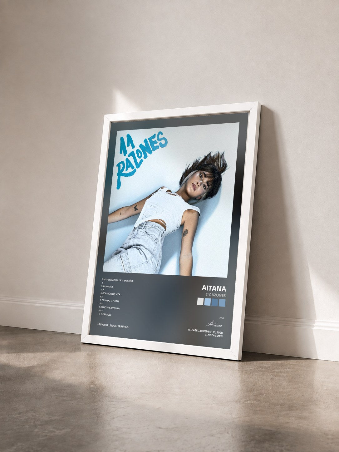 #blanc Tableau de l'album 11 RAZONES de Aitana vu de trois quarts, cadre blanc