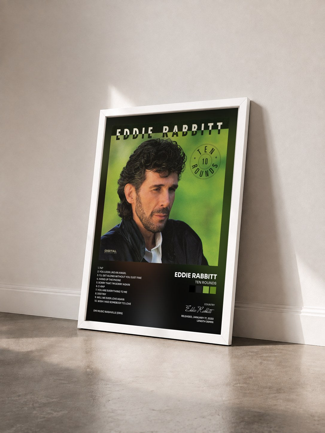 #blanc Tableau de l'album Ten Rounds de Eddie Rabbitt vu de trois quarts, cadre blanc