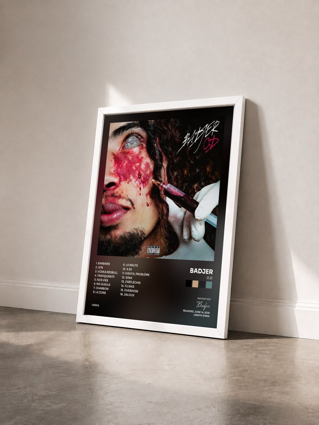 #blanc Tableau de l'album O.D de Badjer vu de trois quarts, cadre blanc
