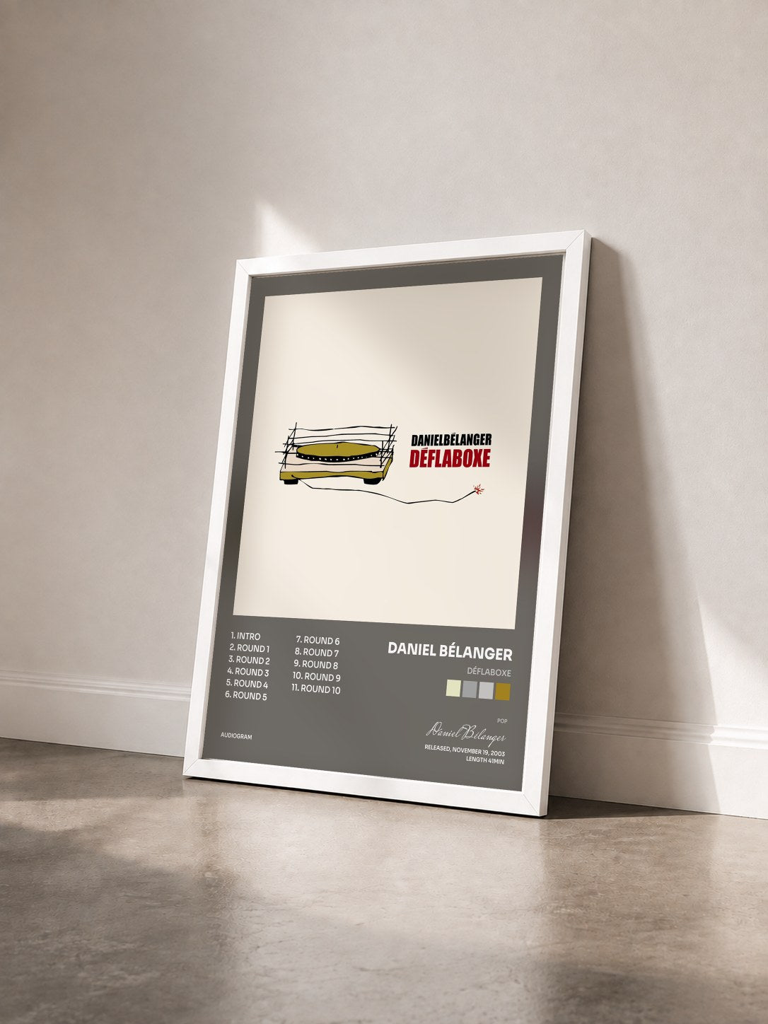 #blanc Tableau de l'album Déflaboxe de Daniel Bélanger vu de trois quarts, cadre blanc