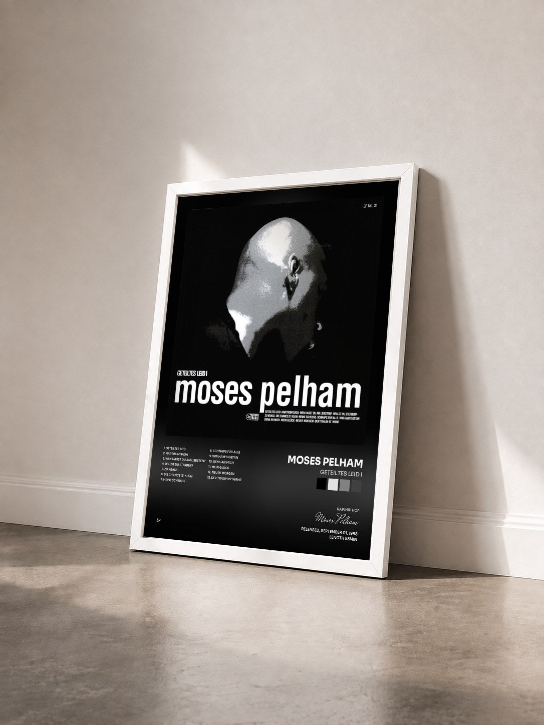 #blanc Tableau de l'album Geteiltes Leid I de Moses Pelham vu de trois quarts, cadre blanc