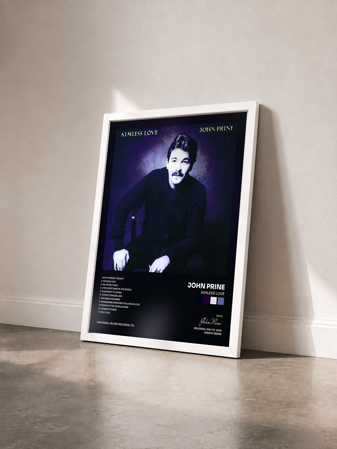 #blanc Tableau de l'album Aimless Love de John Prine vu de trois quarts, cadre blanc