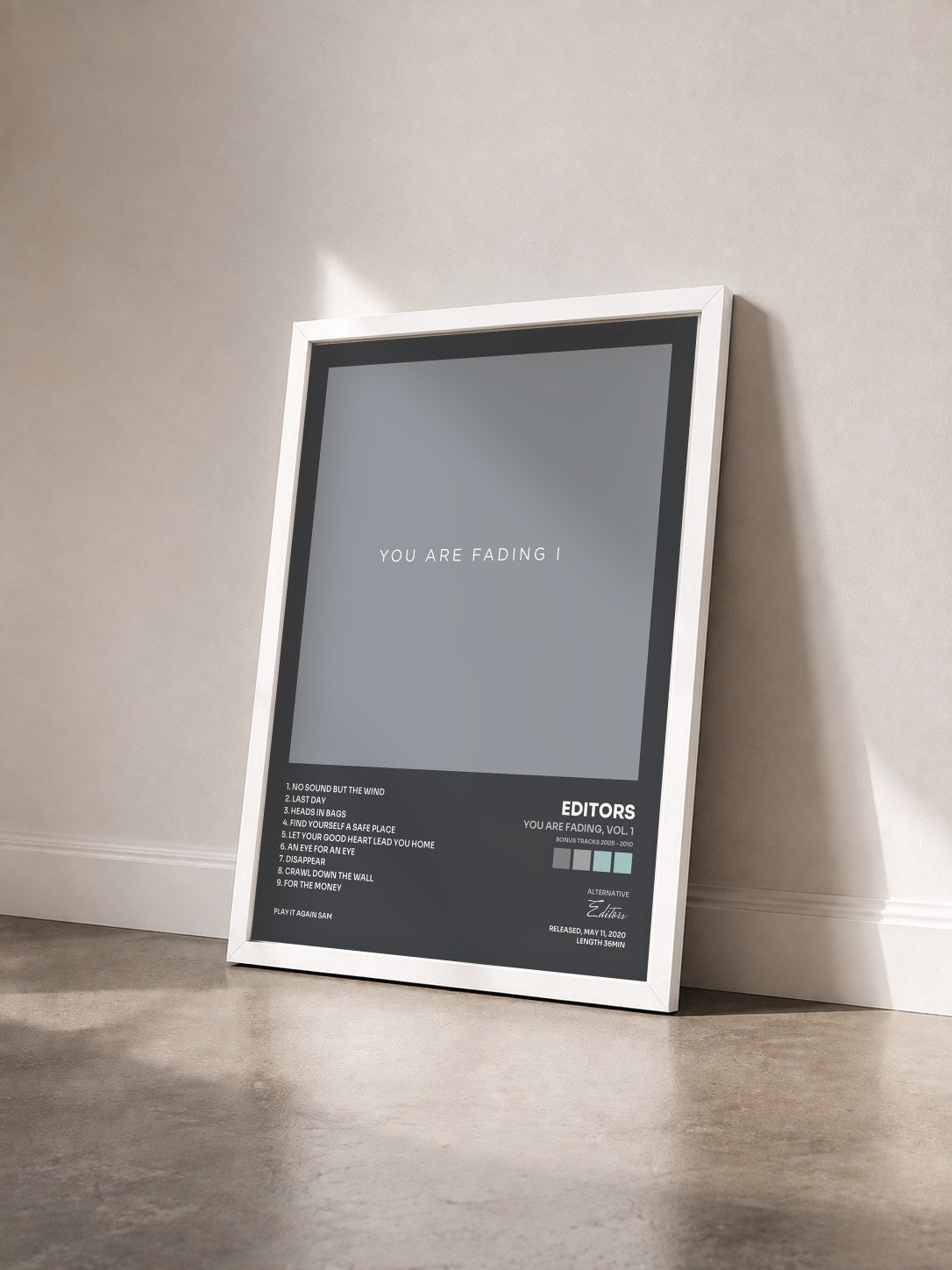 #blanc Tableau de l'album You Are Fading, Vol. 1 (Bonus Tracks 2005 - 2010) de Editors vu de trois quarts, cadre blanc