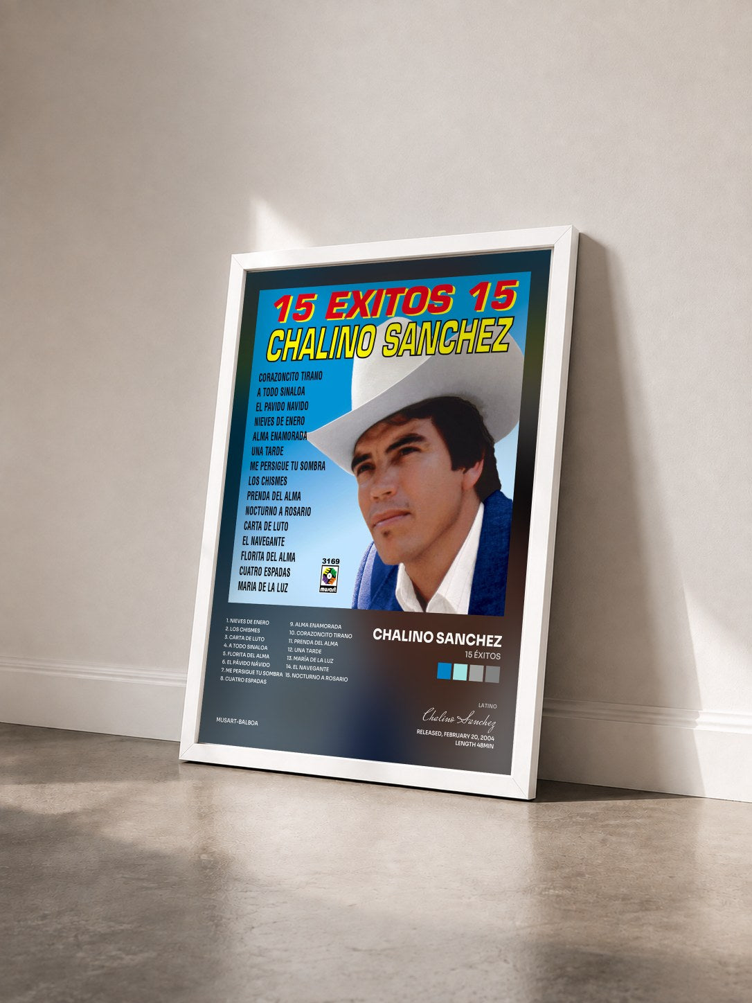 #blanc Tableau de l'album 15 Éxitos de Chalino Sanchez vu de trois quarts, cadre blanc