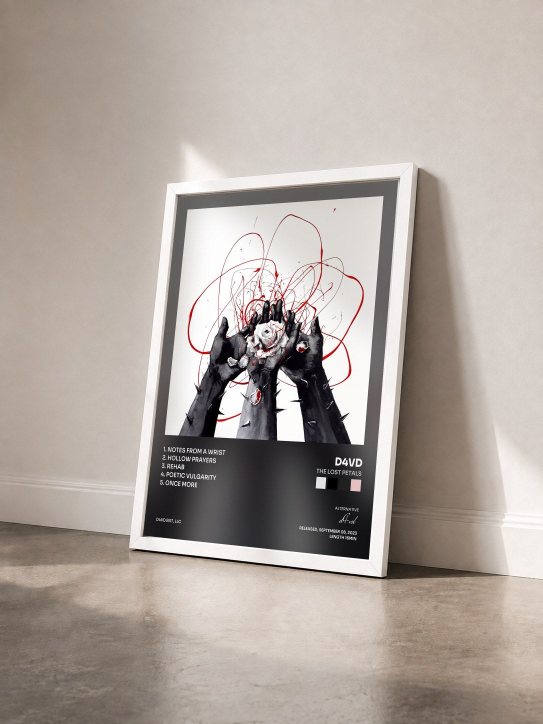#blanc Tableau de l'album The Lost Petals de d4vd vu de trois quarts, cadre blanc