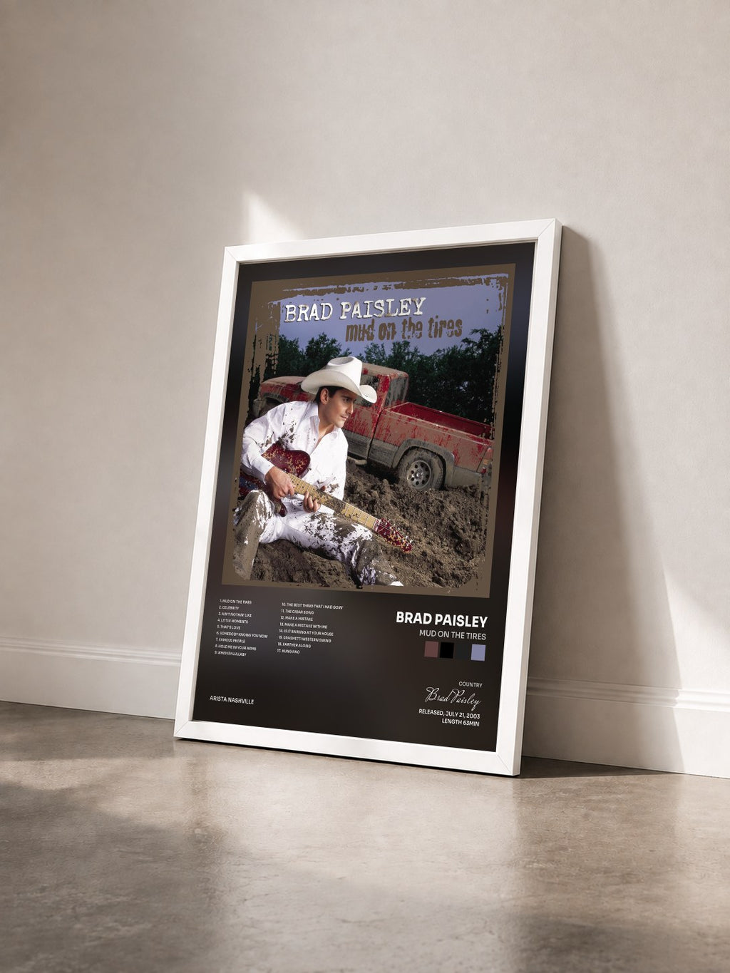 #blanc Mud On The Tires by Brad Paisley as a framed art print seen at an angle, white frame