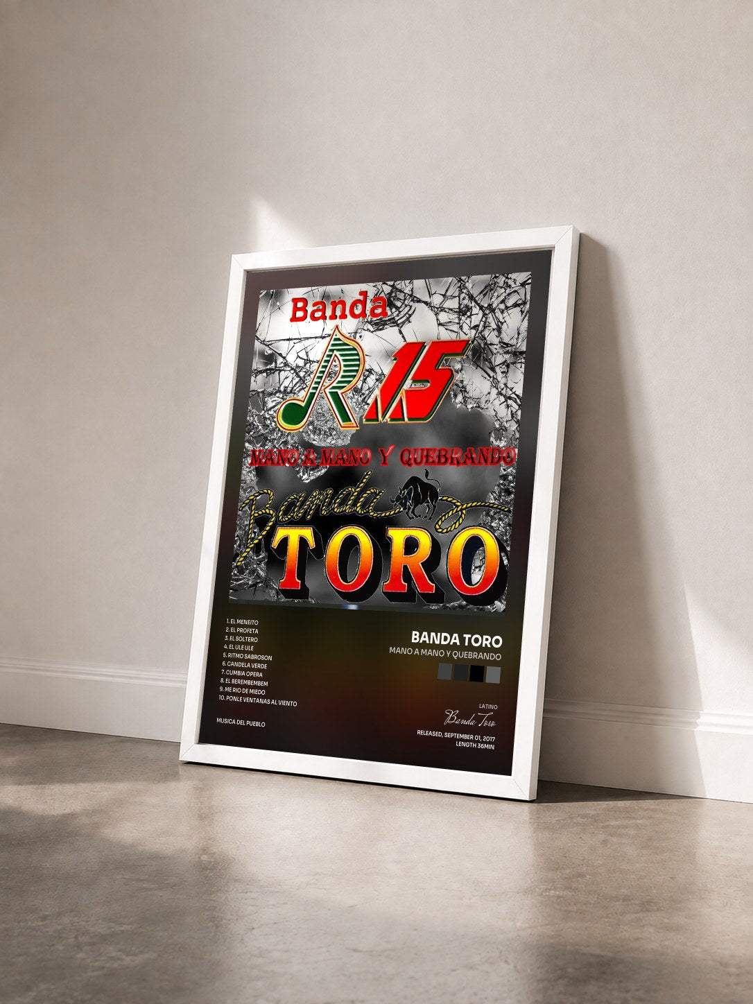 #blanc Tableau de l'album Mano a Mano y Quebrando de Banda Toro vu de trois quarts, cadre blanc
