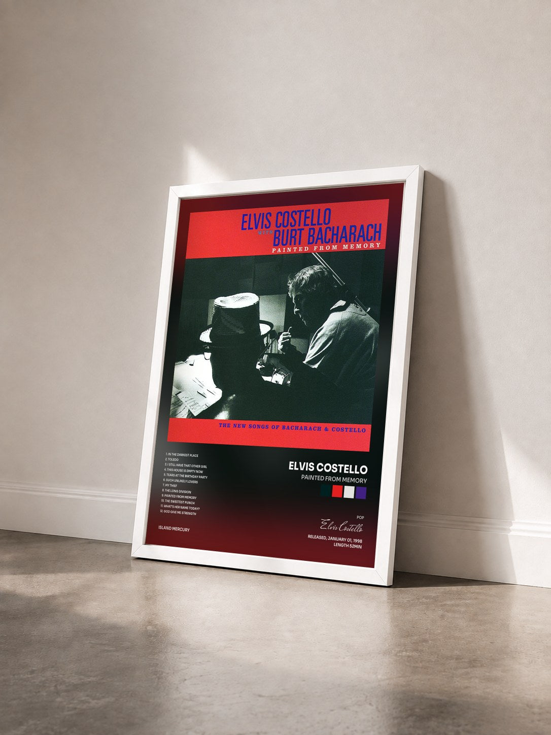 #blanc Tableau de l'album Painted From Memory de Elvis Costello vu de trois quarts, cadre blanc