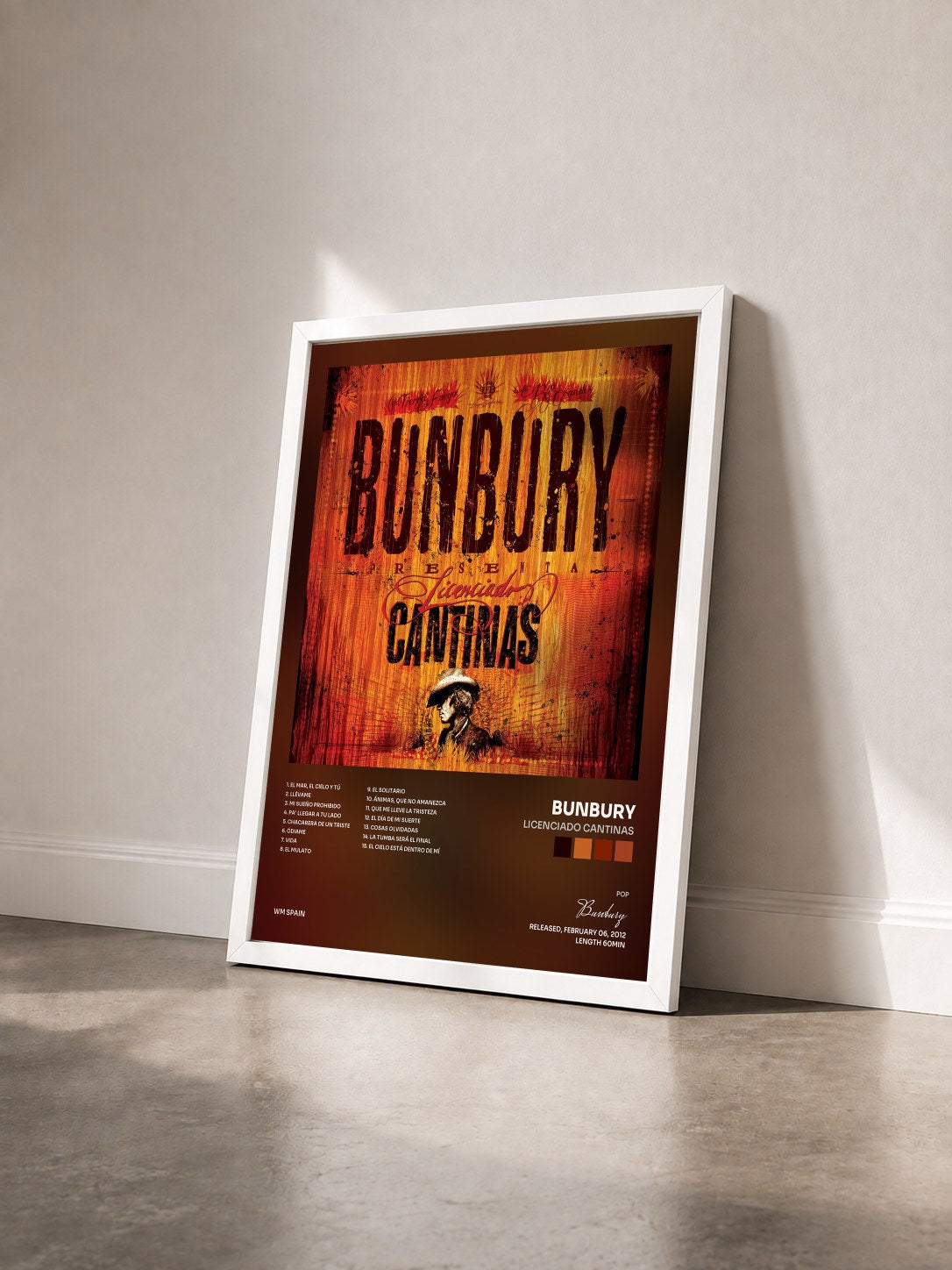 #blanc Tableau de l'album Licenciado cantinas de Bunbury vu de trois quarts, cadre blanc