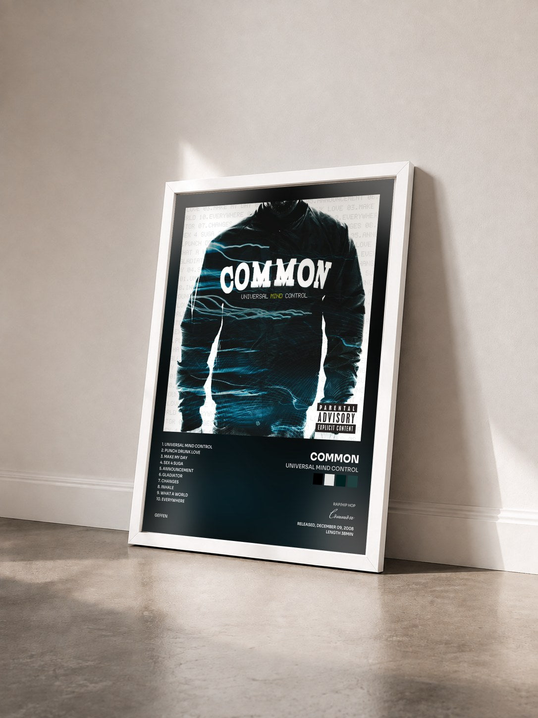#blanc Tableau de l'album Universal Mind Control de Common vu de trois quarts, cadre blanc