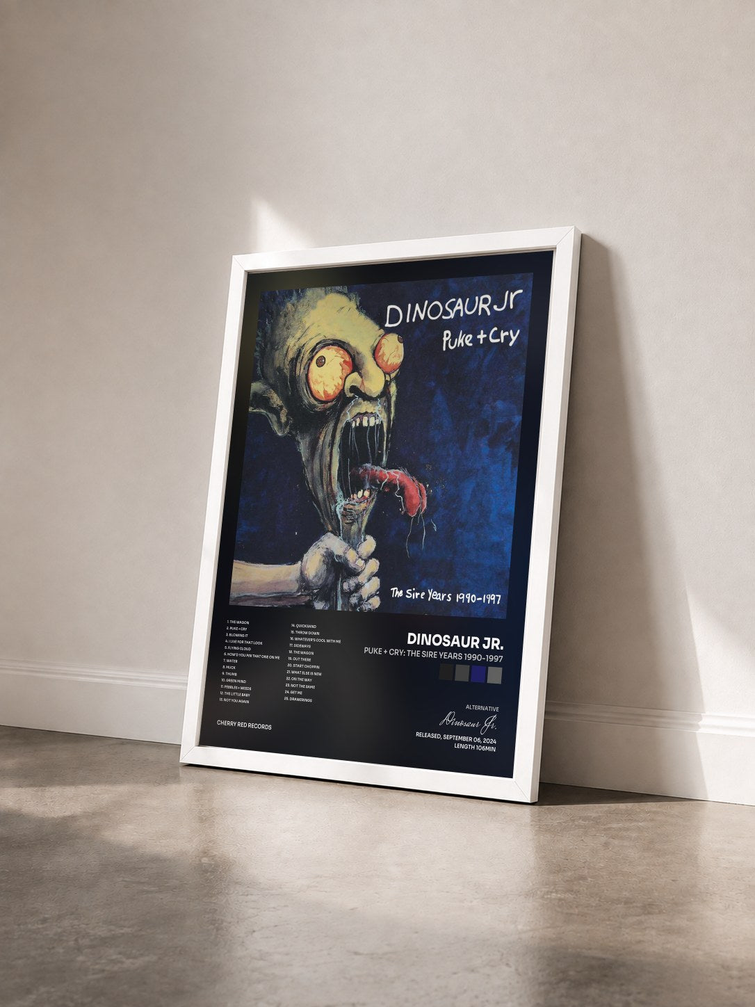 #blanc Tableau de l'album Puke + Cry: The Sire Years 1990-1997 de Dinosaur Jr. vu de trois quarts, cadre blanc