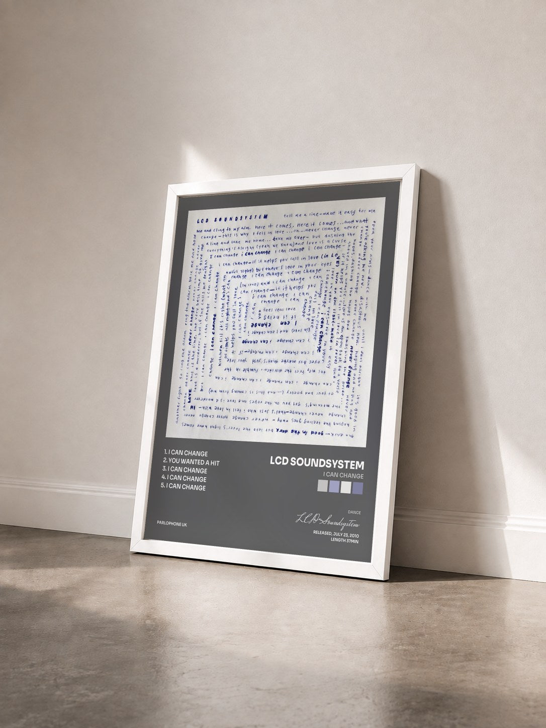 #blanc Tableau de l'album I Can Change de LCD Soundsystem vu de trois quarts, cadre blanc