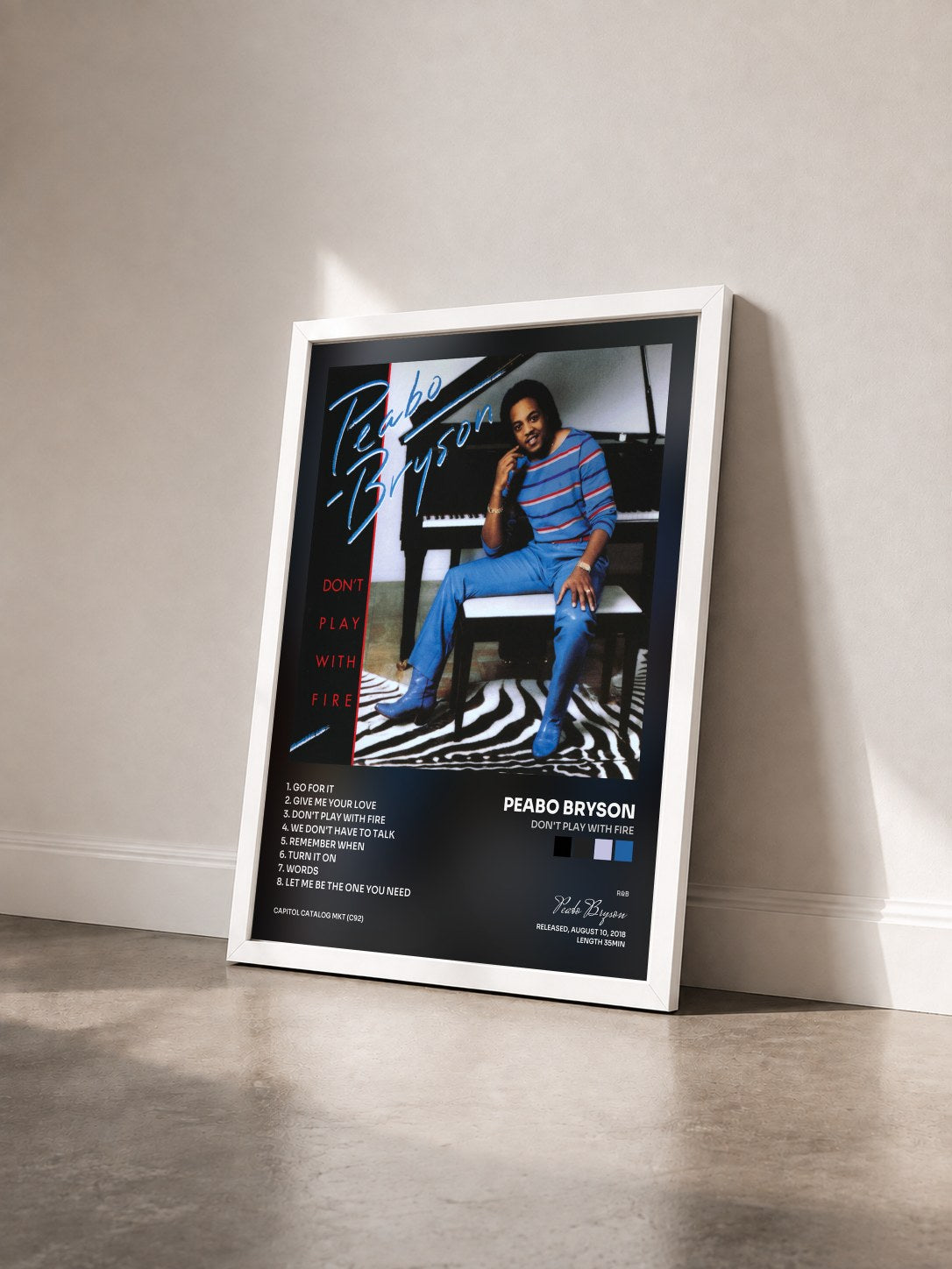 #blanc Tableau de l'album Don't Play With Fire de Peabo Bryson vu de trois quarts, cadre blanc