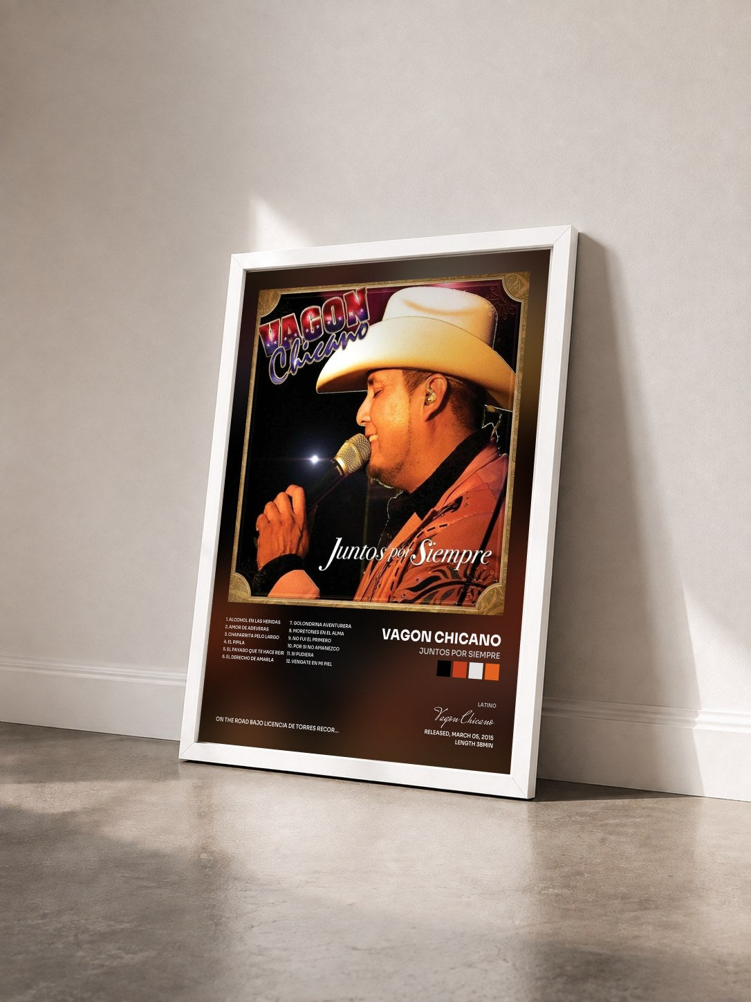 #blanc Tableau de l'album Juntos por Siempre de Vagon Chicano vu de trois quarts, cadre blanc