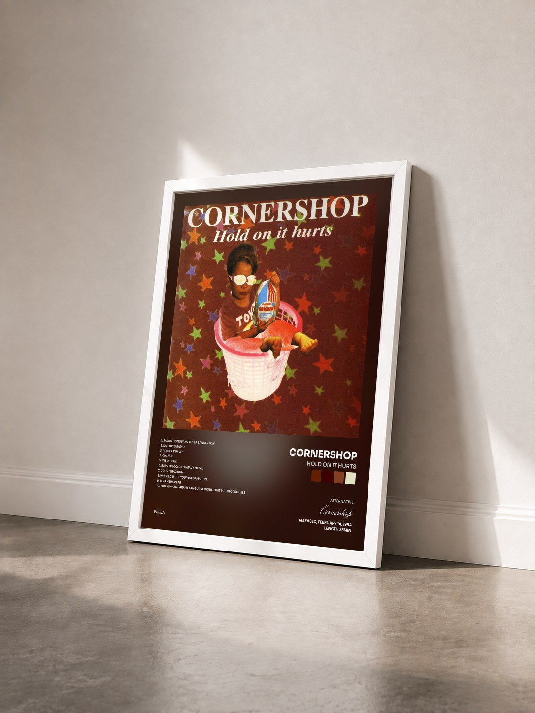 #blanc Tableau de l'album Hold On It Hurts de Cornershop vu de trois quarts, cadre blanc