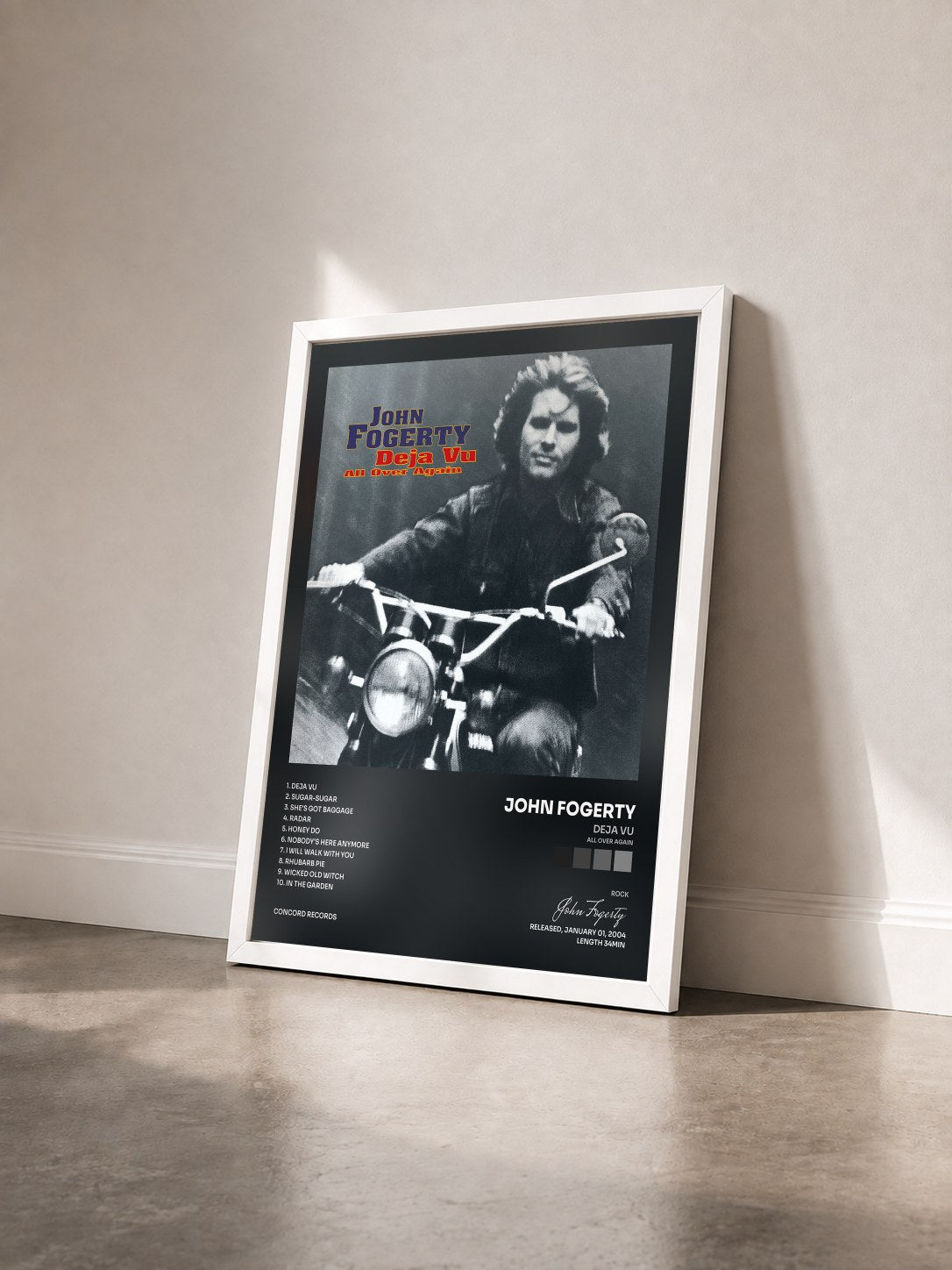 #blanc Tableau de l'album Deja Vu (All Over Again) de John Fogerty vu de trois quarts, cadre blanc