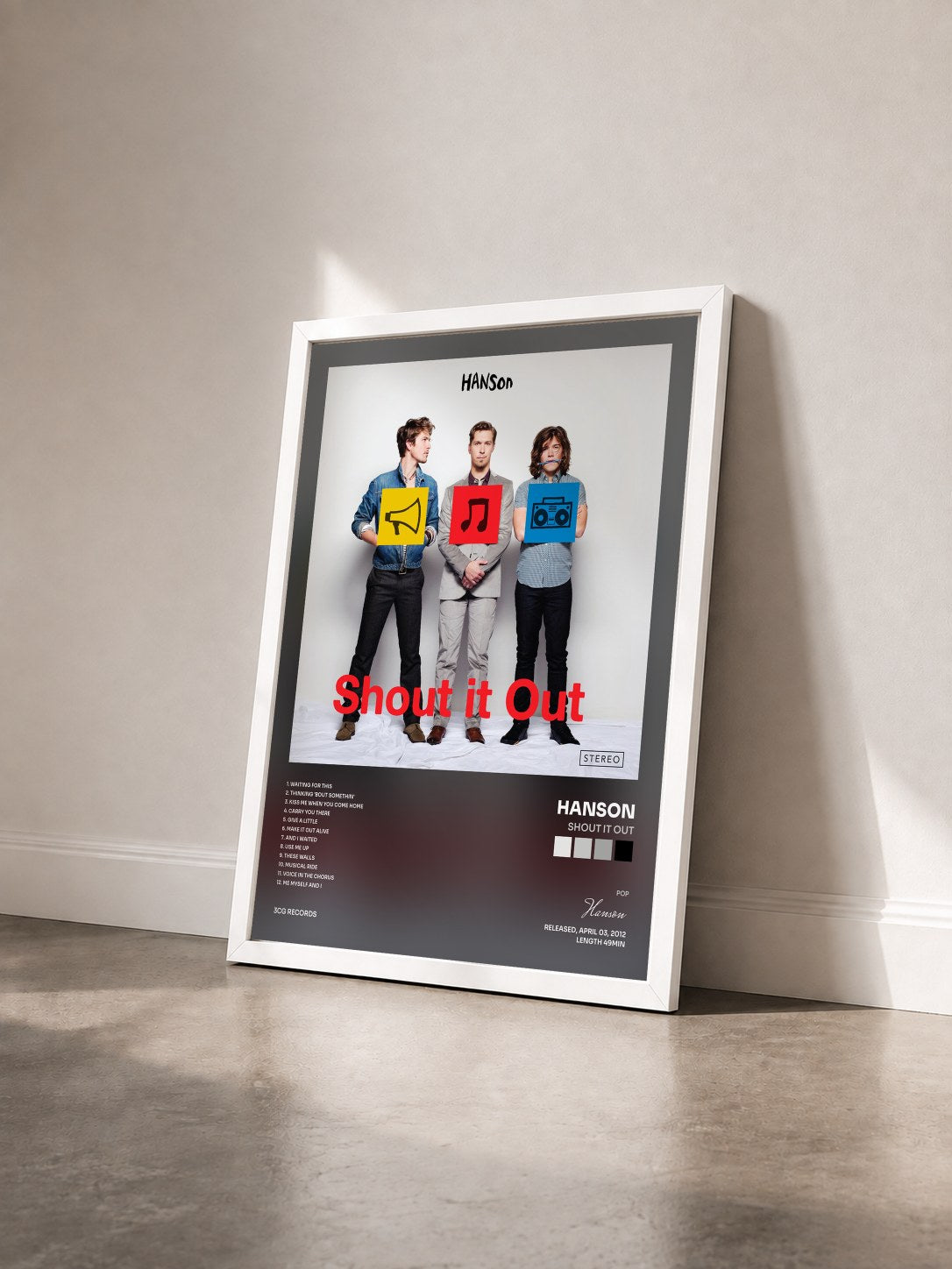 #blanc Tableau de l'album Shout It Out de Hanson vu de trois quarts, cadre blanc