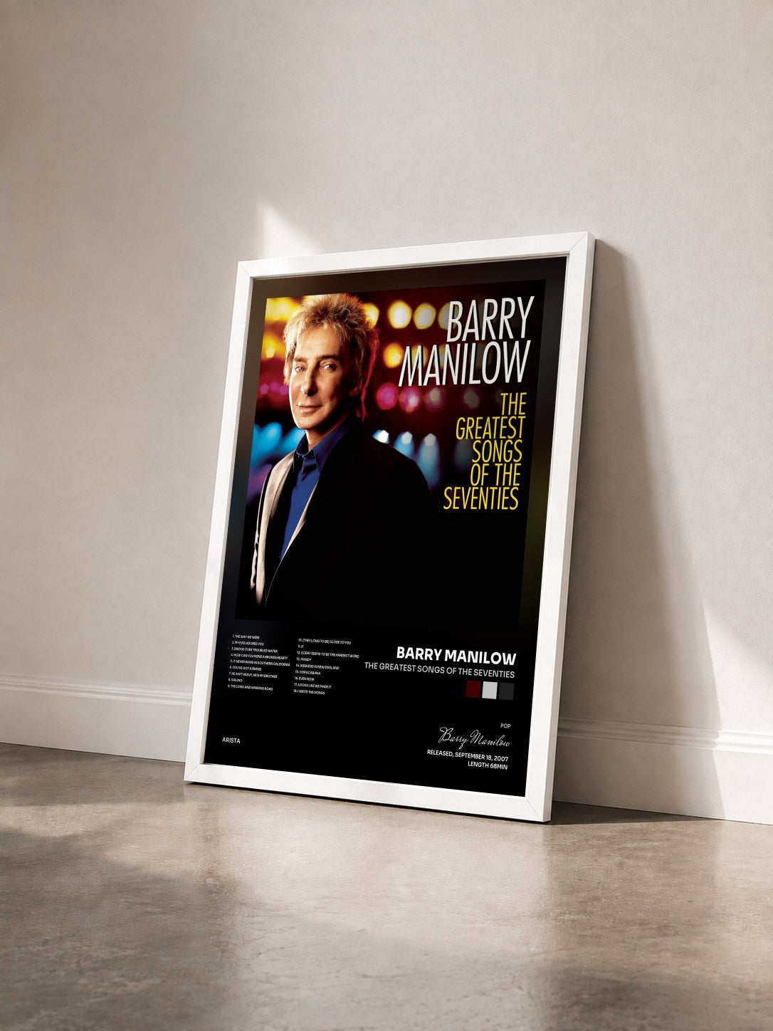 #blanc Tableau de l'album The Greatest Songs Of The Seventies de Barry Manilow vu de trois quarts, cadre blanc