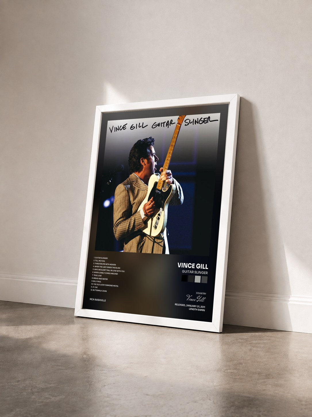 #blanc Tableau de l'album Guitar Slinger de Vince Gill vu de trois quarts, cadre blanc