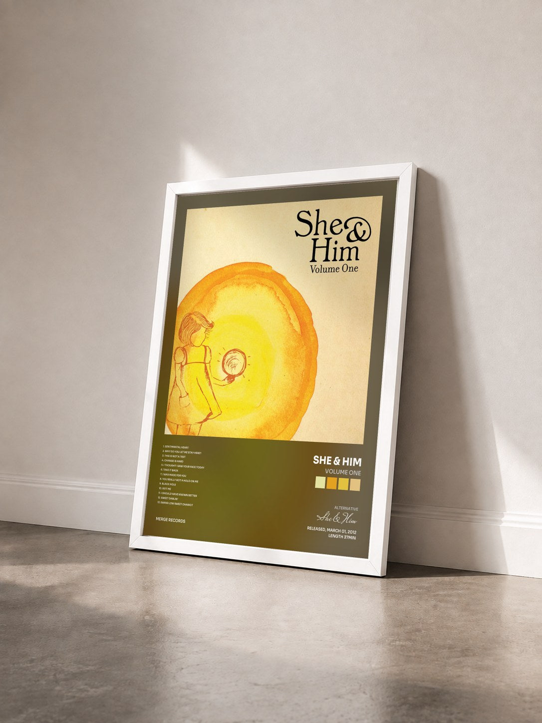 #blanc Tableau de l'album Volume One de She & Him vu de trois quarts, cadre blanc