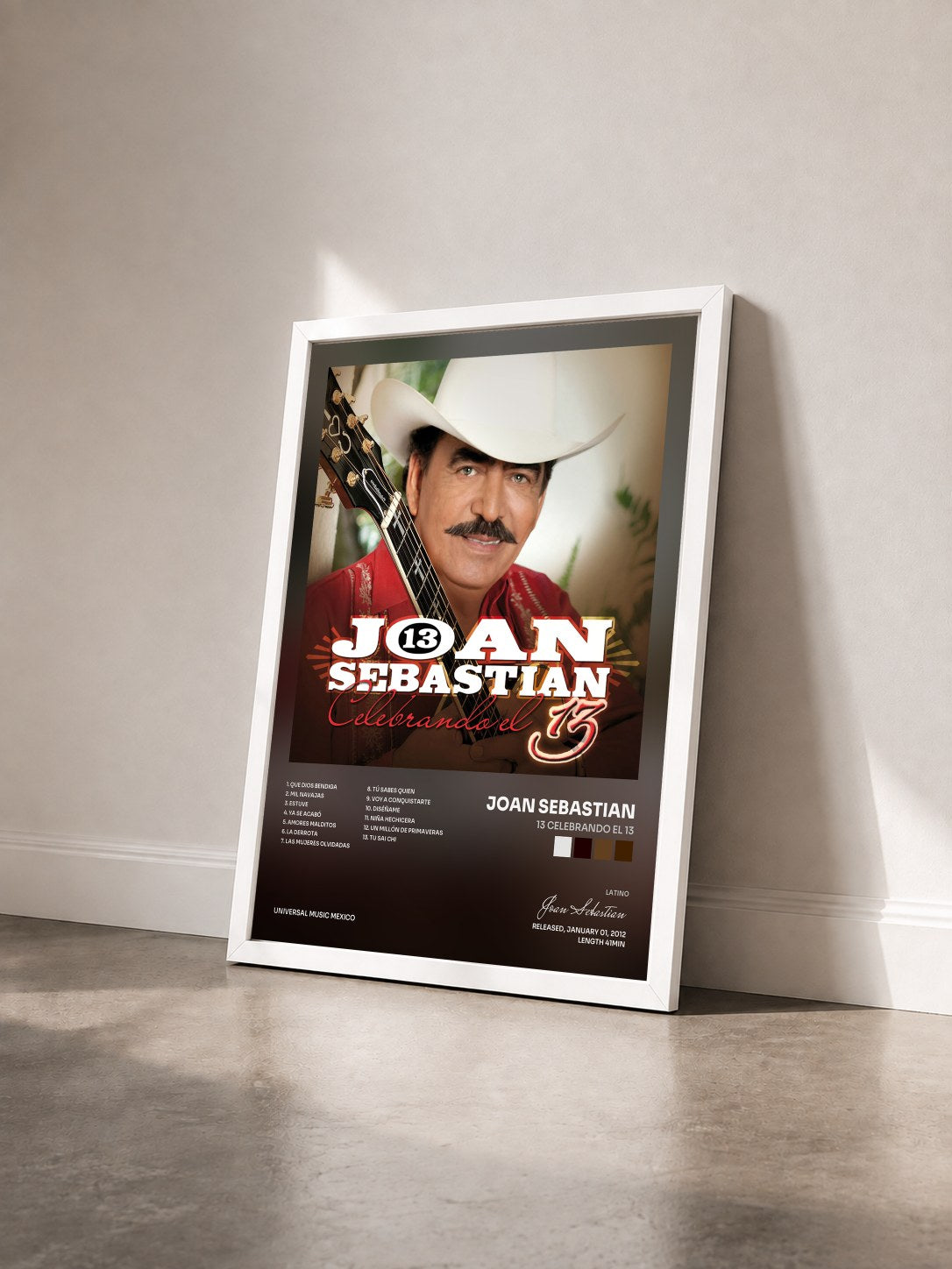 #blanc Tableau de l'album 13 Celebrando El 13 de Joan Sebastian vu de trois quarts, cadre blanc