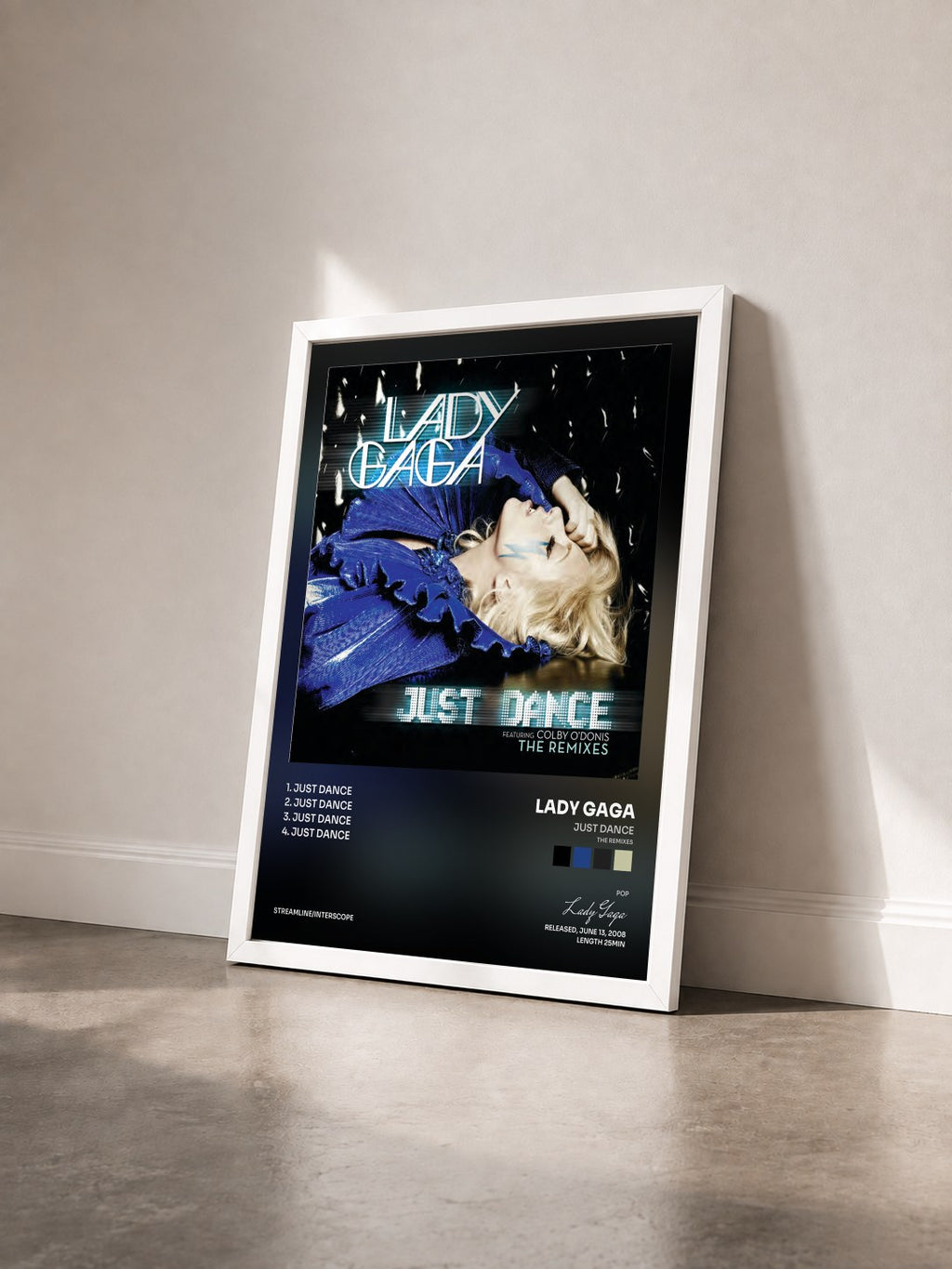 #blanc Tableau de l'album Just Dance (The Remixes) de Lady Gaga vu de trois quarts, cadre blanc