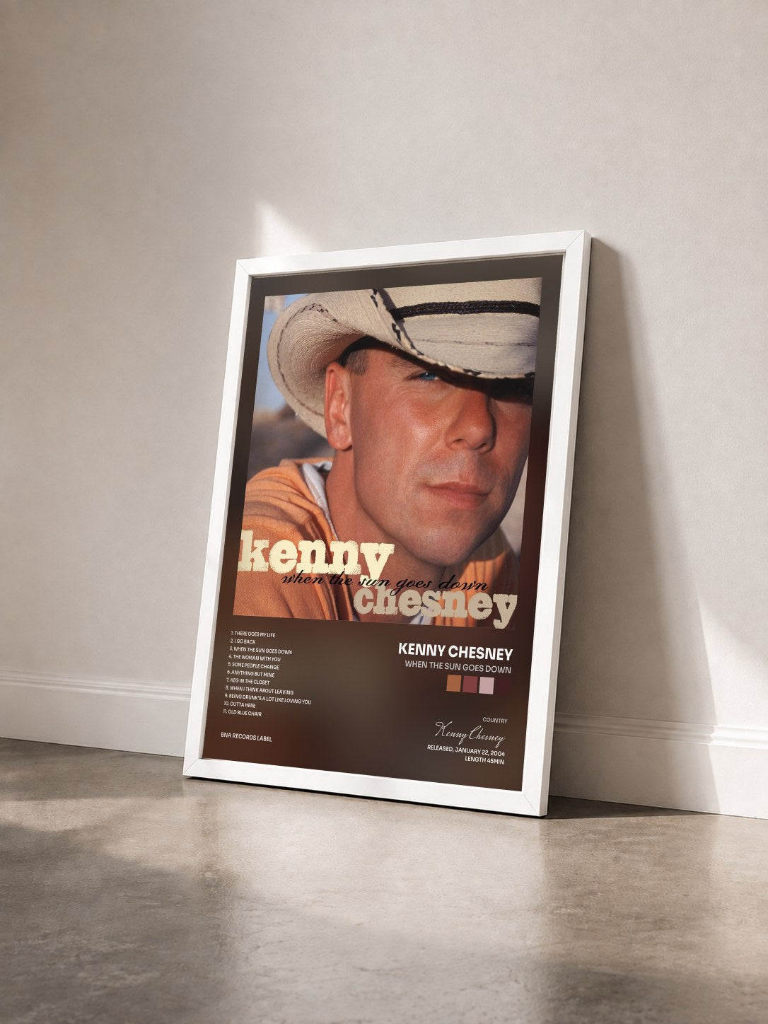 #blanc Tableau de l'album When The Sun Goes Down de Kenny Chesney vu de trois quarts, cadre blanc