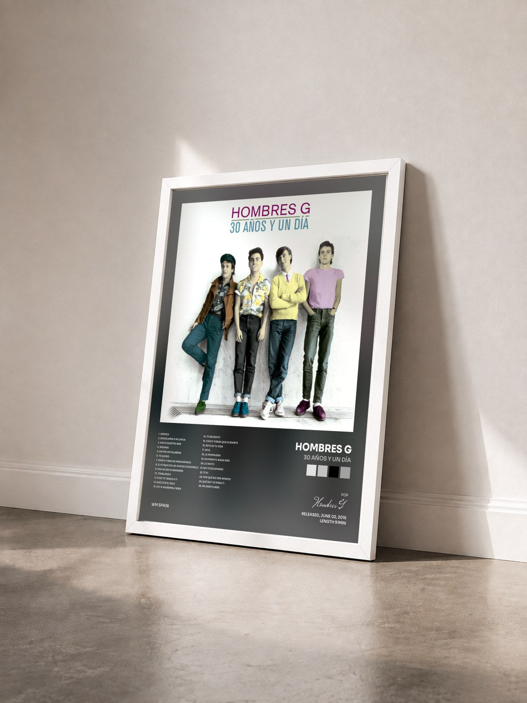 #blanc Tableau de l'album 30 años y un día de Hombres G vu de trois quarts, cadre blanc