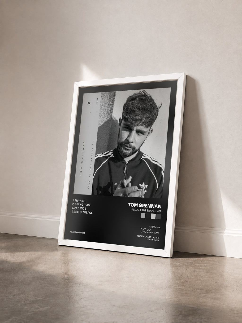 #blanc Tableau de l'album Release the Brakes - EP de Tom Grennan vu de trois quarts, cadre blanc