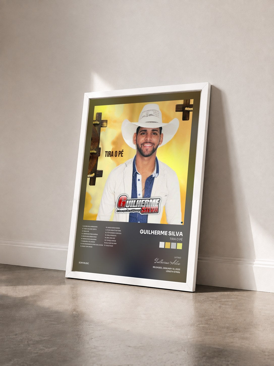 #blanc Tableau de l'album Tira o Pé de Guilherme Silva vu de trois quarts, cadre blanc