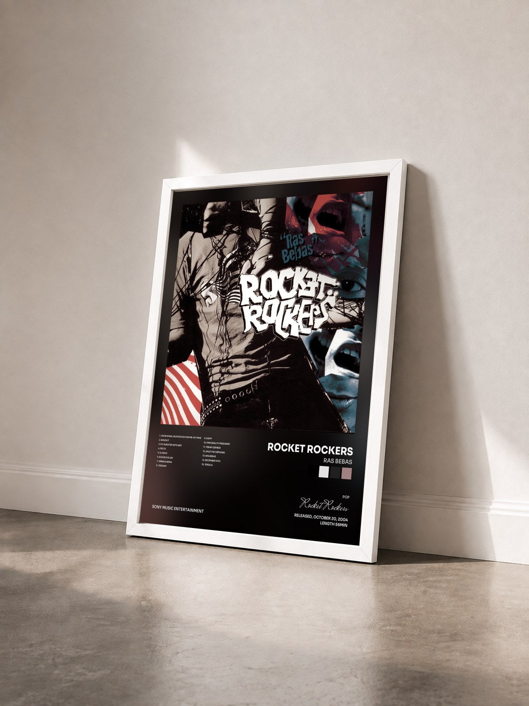 #blanc Tableau de l'album Ras Bebas de Rocket Rockers vu de trois quarts, cadre blanc