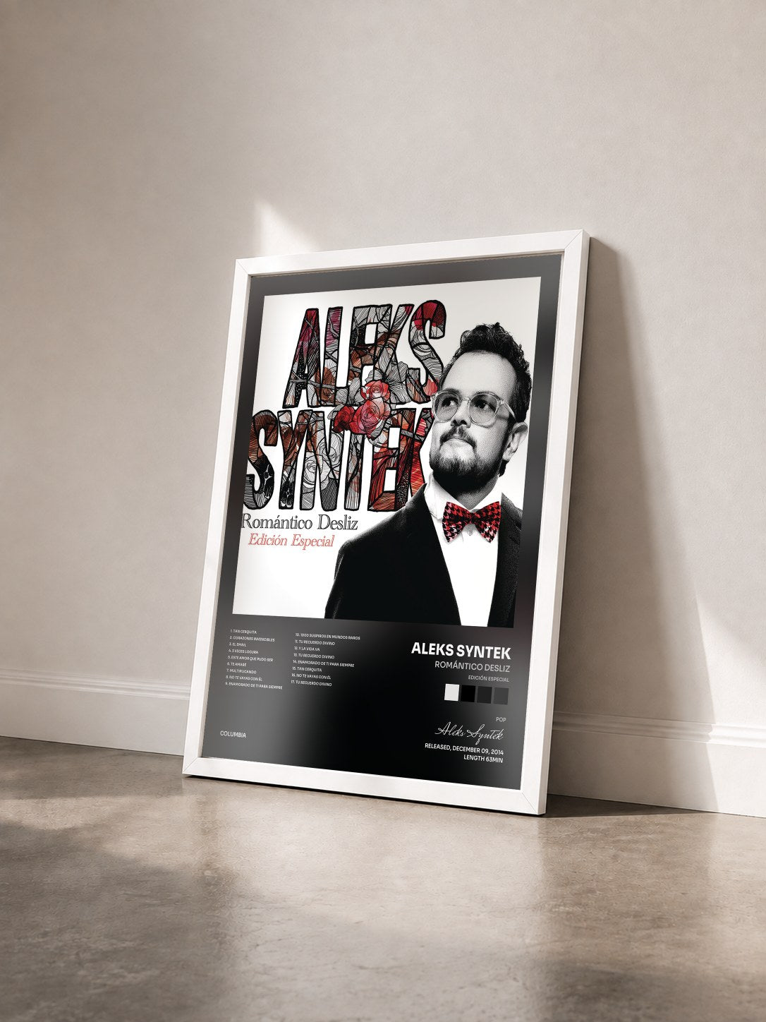 #blanc Tableau de l'album Romántico Desliz (Edición Especial) de Aleks Syntek vu de trois quarts, cadre blanc