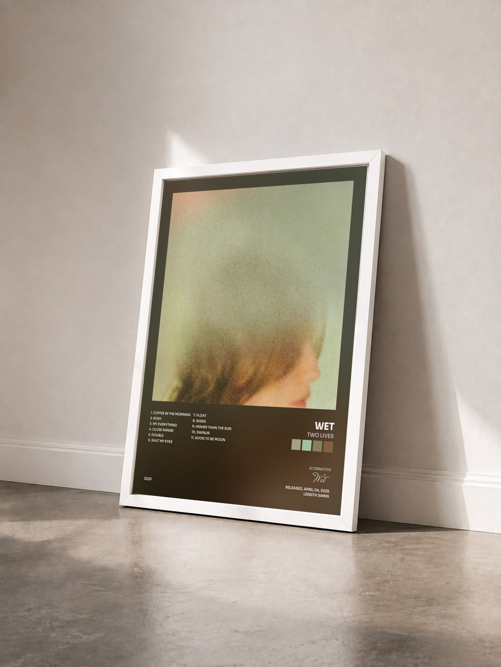 #blanc Tableau de l'album Two Lives de Wet vu de trois quarts, cadre blanc