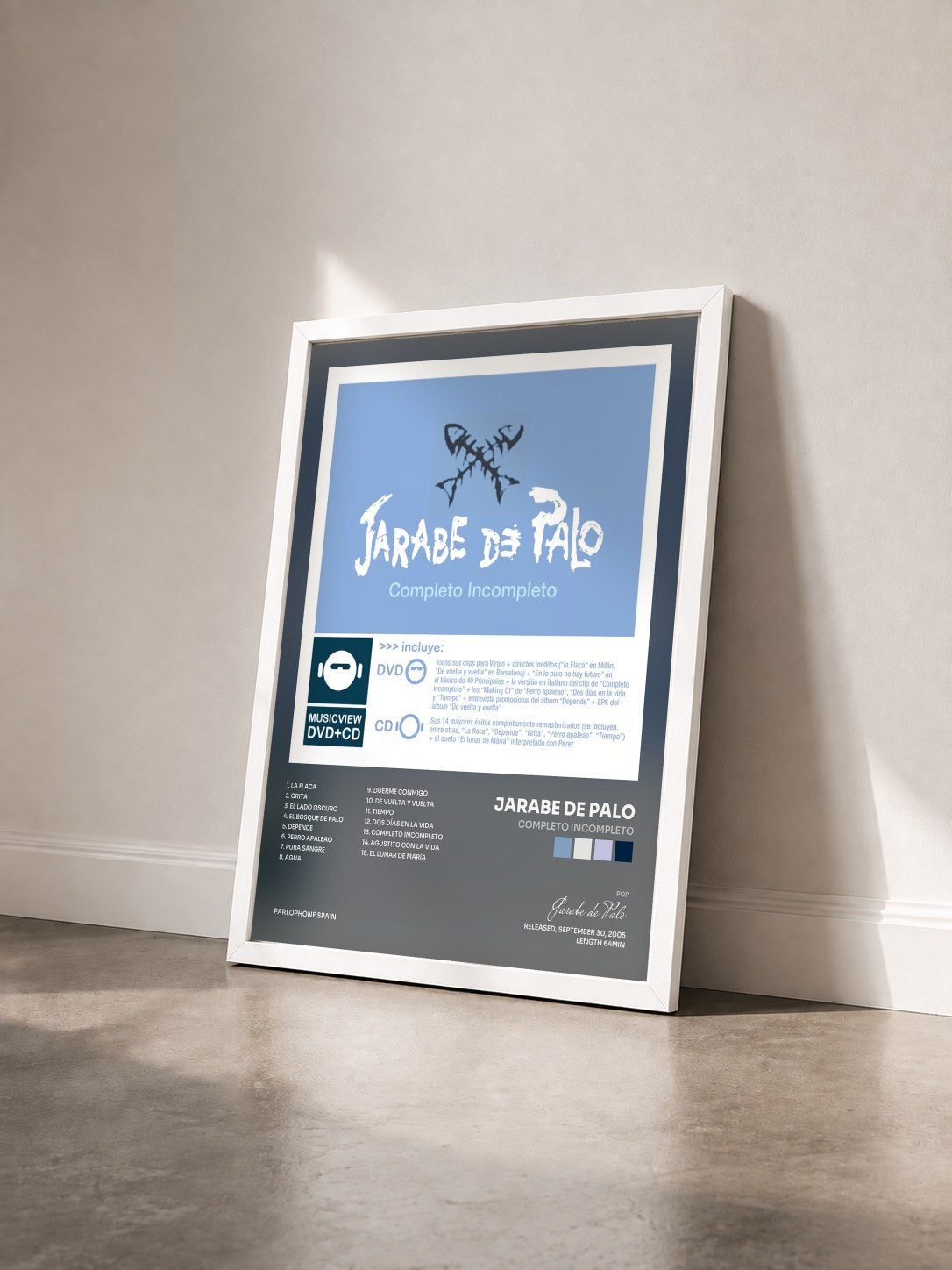 #blanc Tableau de l'album Completo Incompleto de Jarabe de Palo vu de trois quarts, cadre blanc