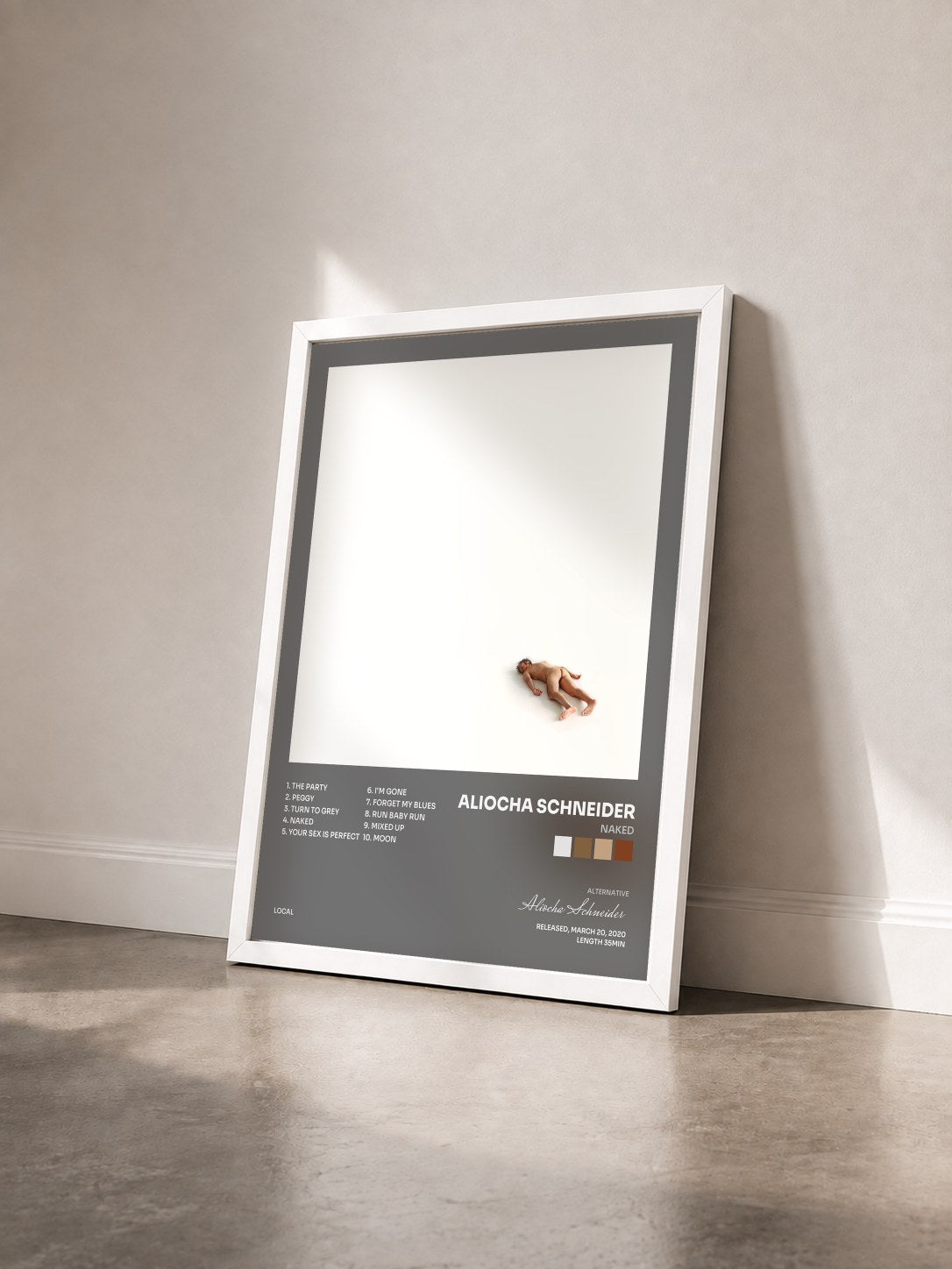 #blanc Tableau de l'album Naked de Aliocha Schneider vu de trois quarts, cadre blanc