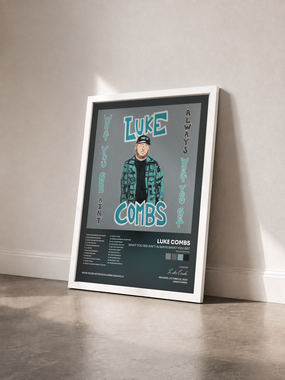 #blanc Tableau de l'album What You See Ain't Always What You Get (Deluxe Edition) de Luke Combs vu de trois quarts, cadre blanc