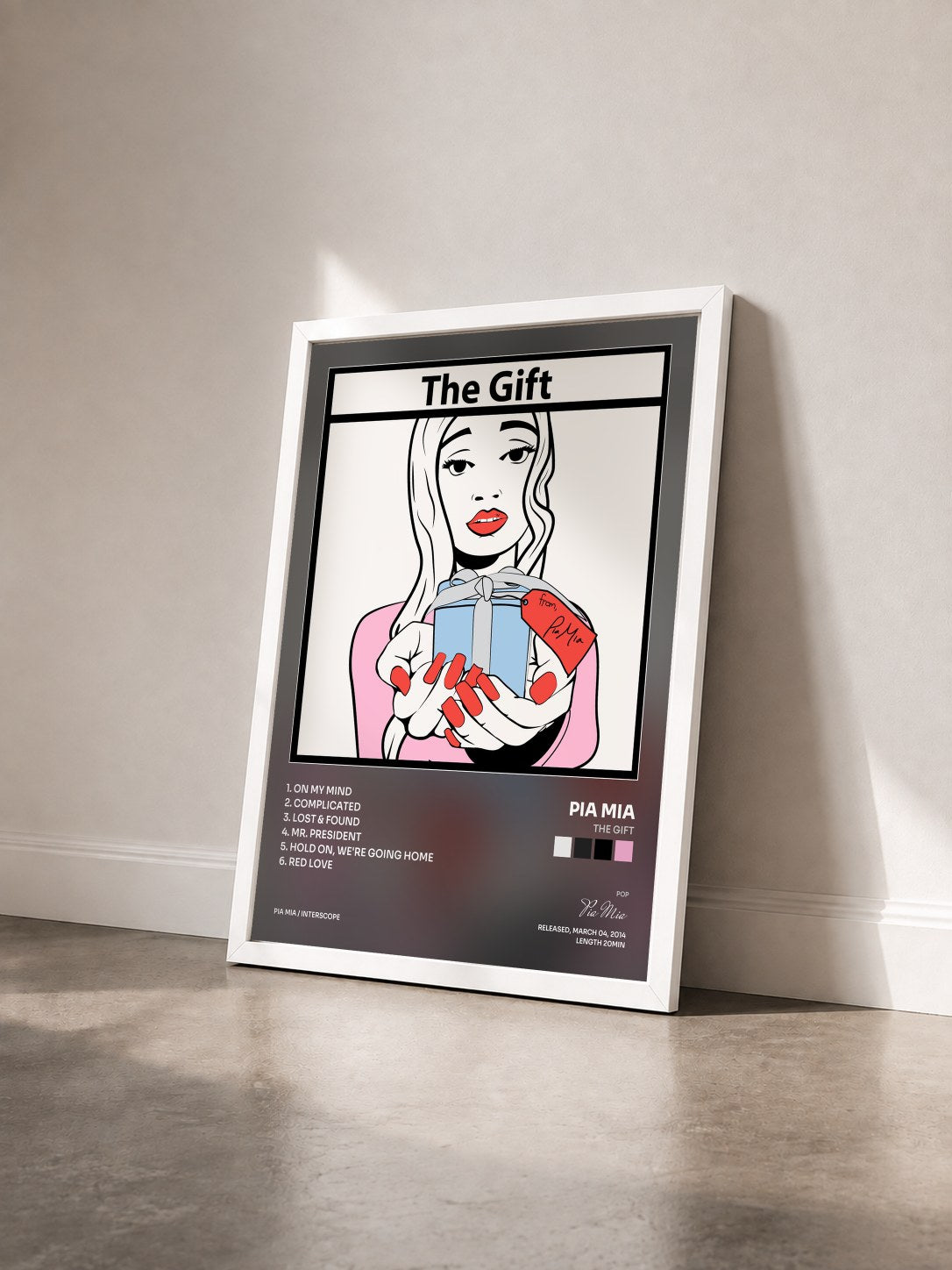 #blanc Tableau de l'album The Gift de Pia Mia vu de trois quarts, cadre blanc