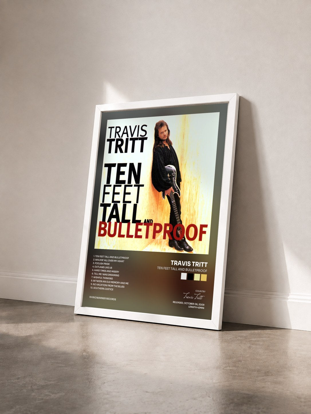 #blanc Tableau de l'album Ten Feet Tall and Bulletproof de Travis Tritt vu de trois quarts, cadre blanc