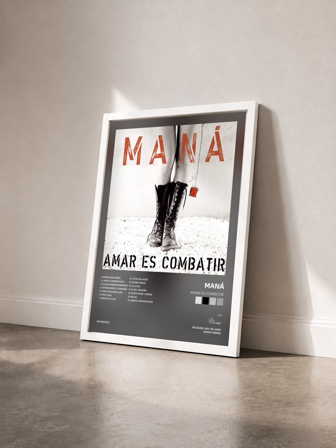 #blanc Tableau de l'album Amar Es Combatir de Maná vu de trois quarts, cadre blanc