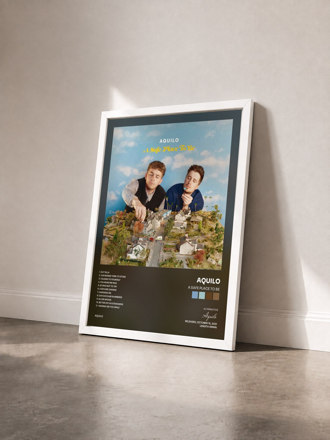 #blanc Tableau de l'album A Safe Place To Be de Aquilo vu de trois quarts, cadre blanc