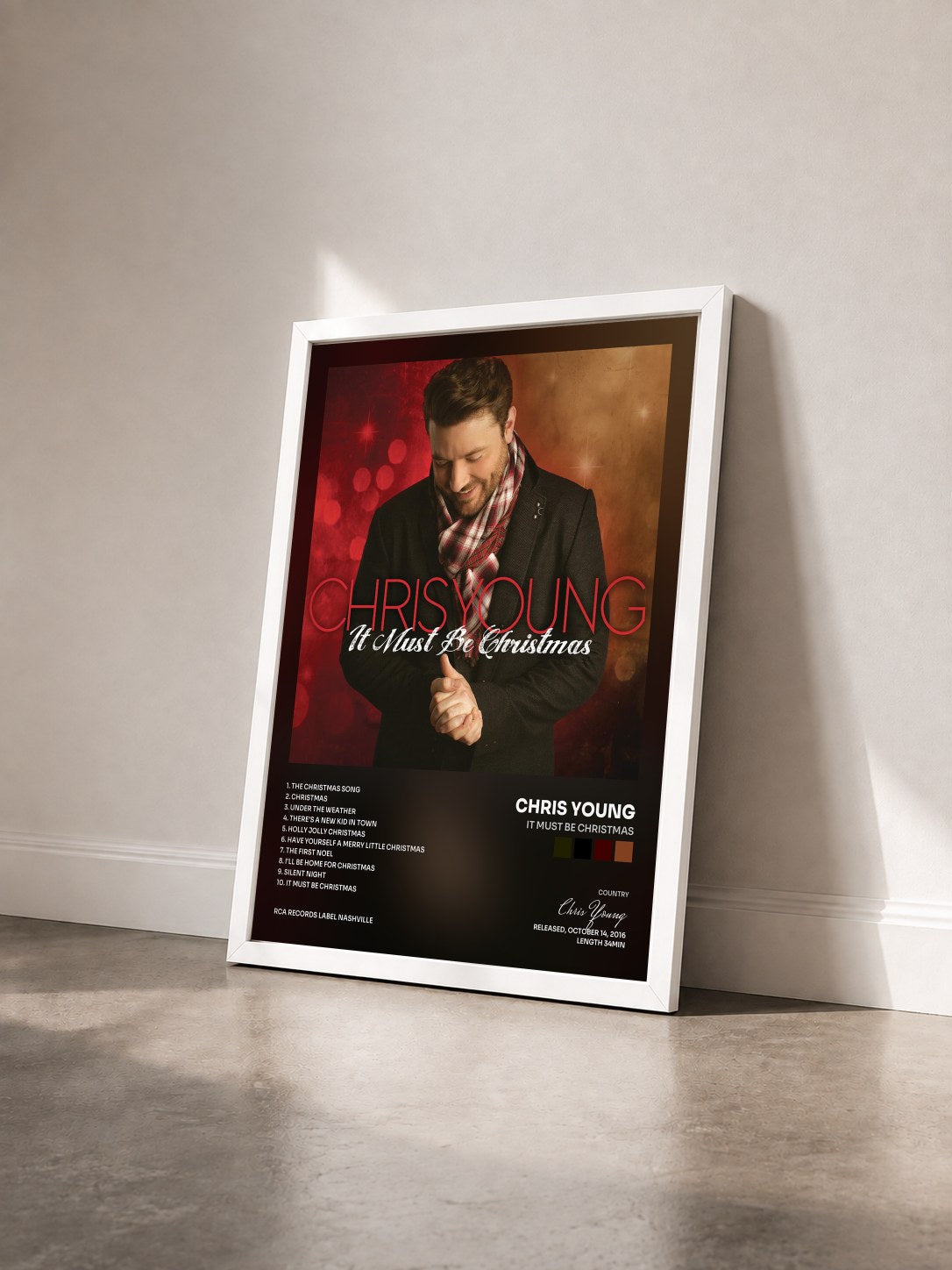 #blanc Tableau de l'album It Must Be Christmas de Chris Young vu de trois quarts, cadre blanc