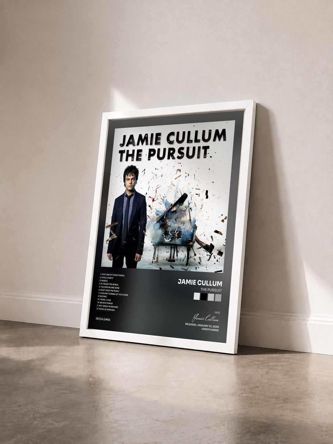 #blanc Tableau de l'album The Pursuit de Jamie Cullum vu de trois quarts, cadre blanc