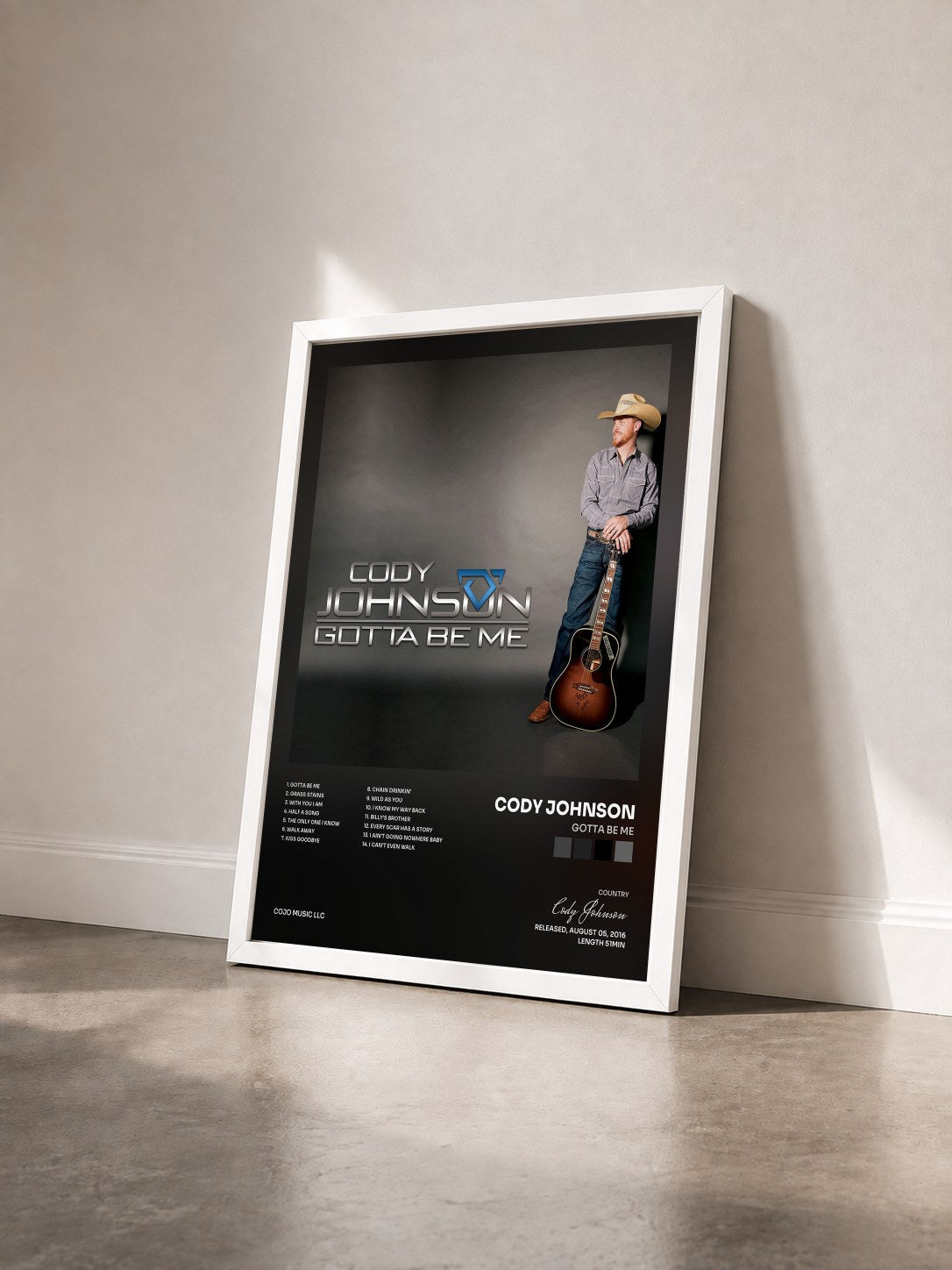 #blanc Tableau de l'album Gotta Be Me de Cody Johnson vu de trois quarts, cadre blanc