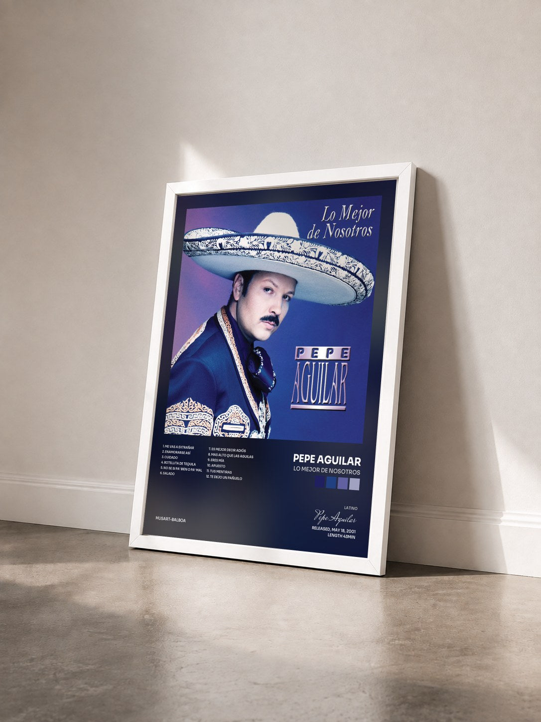 #blanc Tableau de l'album Lo Mejor De Nosotros de Pepe Aguilar vu de trois quarts, cadre blanc
