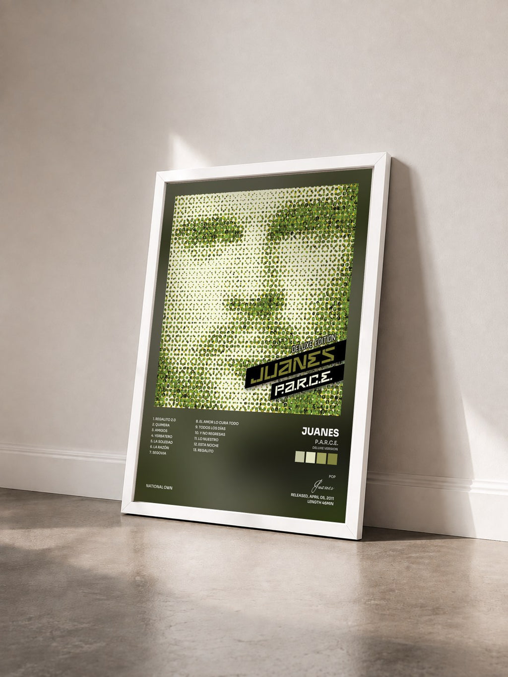 #blanc Tableau de l'album P.A.R.C.E. (Deluxe Version) de Juanes vu de trois quarts, cadre blanc