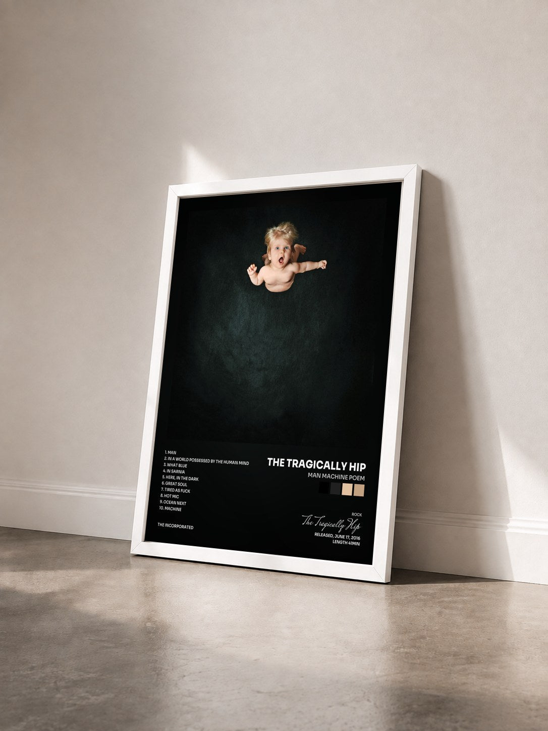 #blanc Tableau de l'album Man Machine Poem de The Tragically Hip vu de trois quarts, cadre blanc