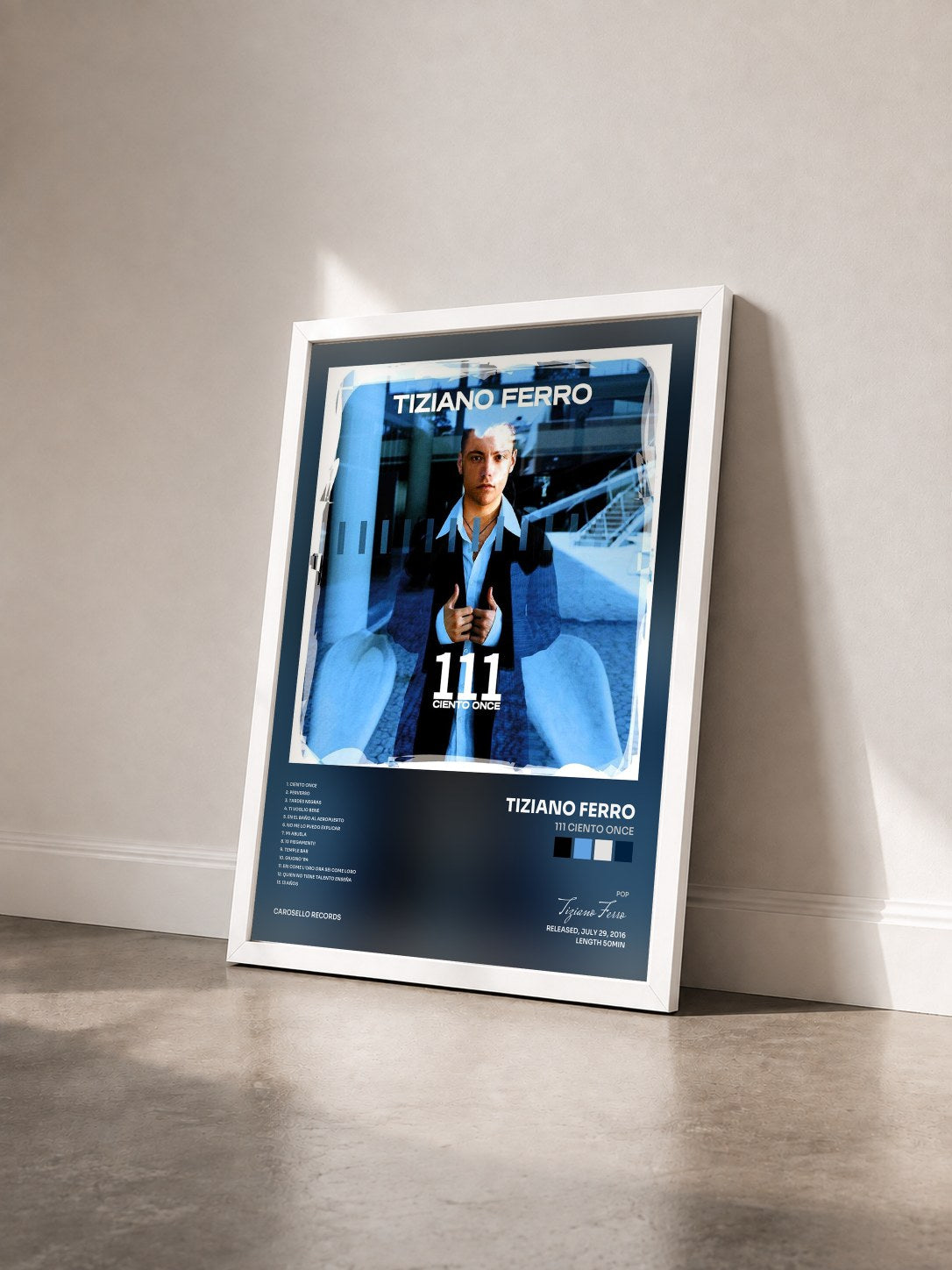 #blanc Tableau de l'album 111 Ciento Once de Tiziano Ferro vu de trois quarts, cadre blanc