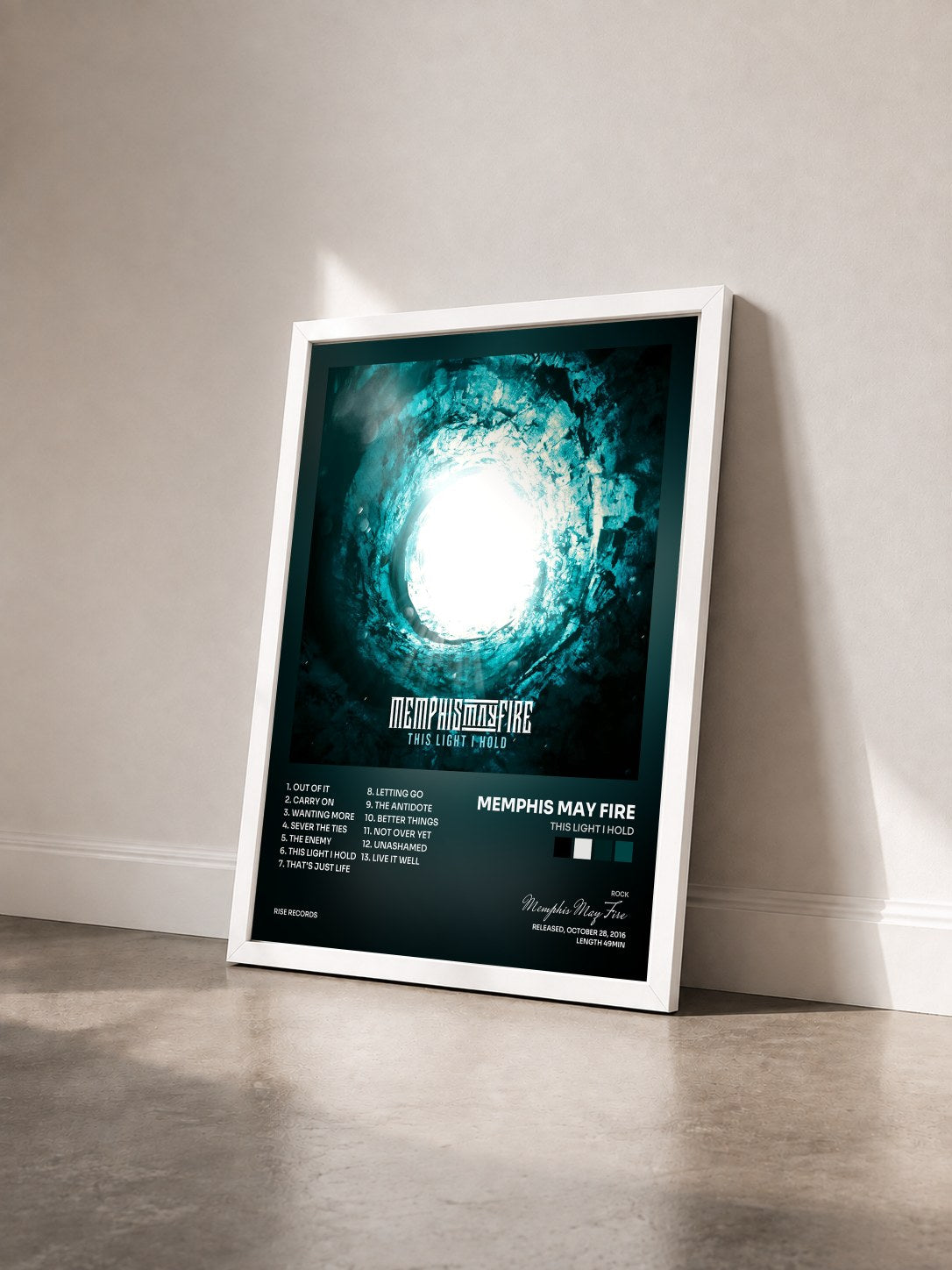 #blanc Tableau de l'album This Light I Hold de Memphis May Fire vu de trois quarts, cadre blanc