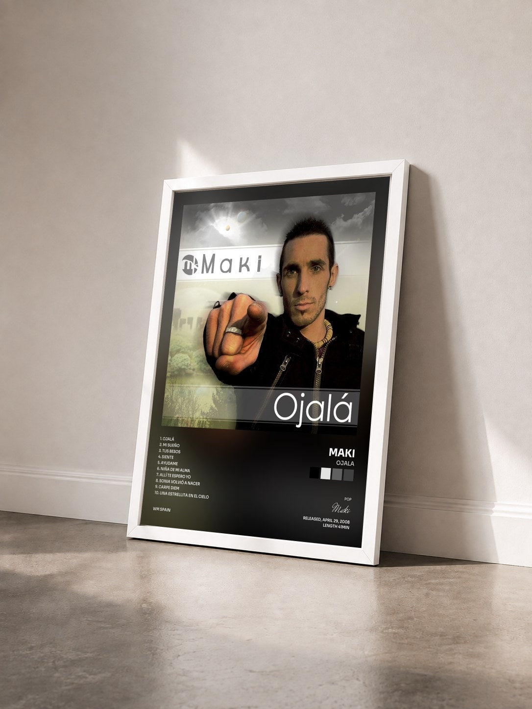#blanc Tableau de l'album Ojala de Maki vu de trois quarts, cadre blanc