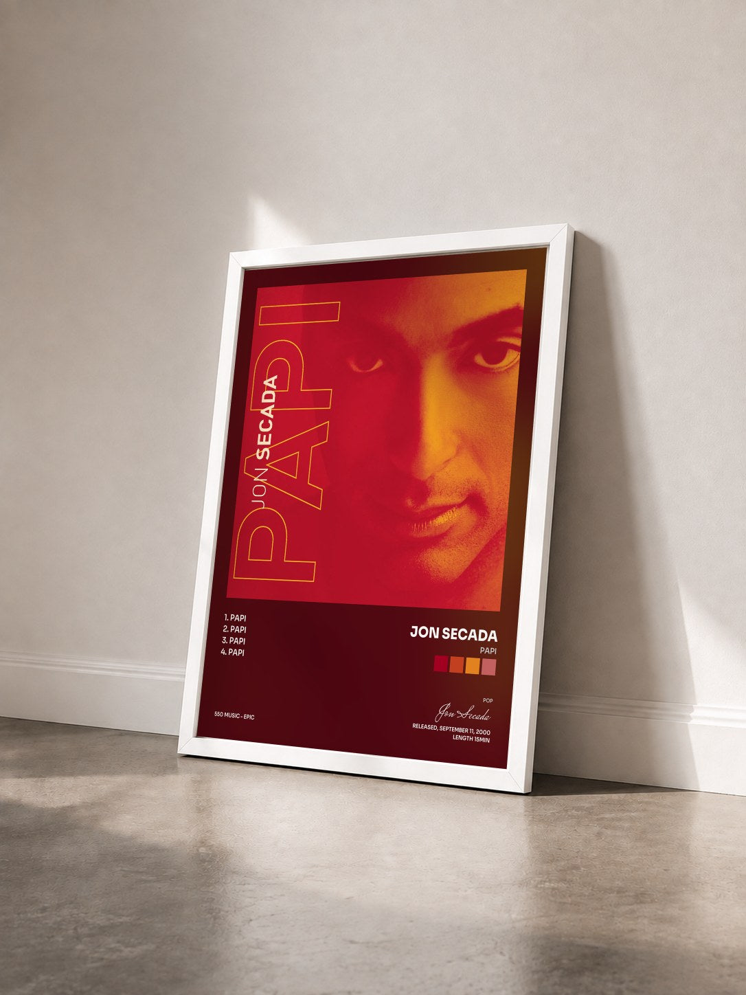 #blanc Tableau de l'album Papi de Jon Secada vu de trois quarts, cadre blanc